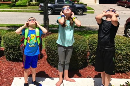 kids looking at eclipse