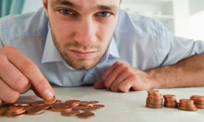 man counting pennies