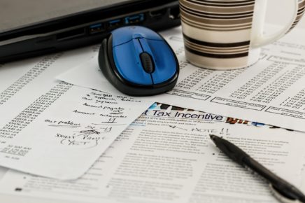 computer mouse on a cluttered desk